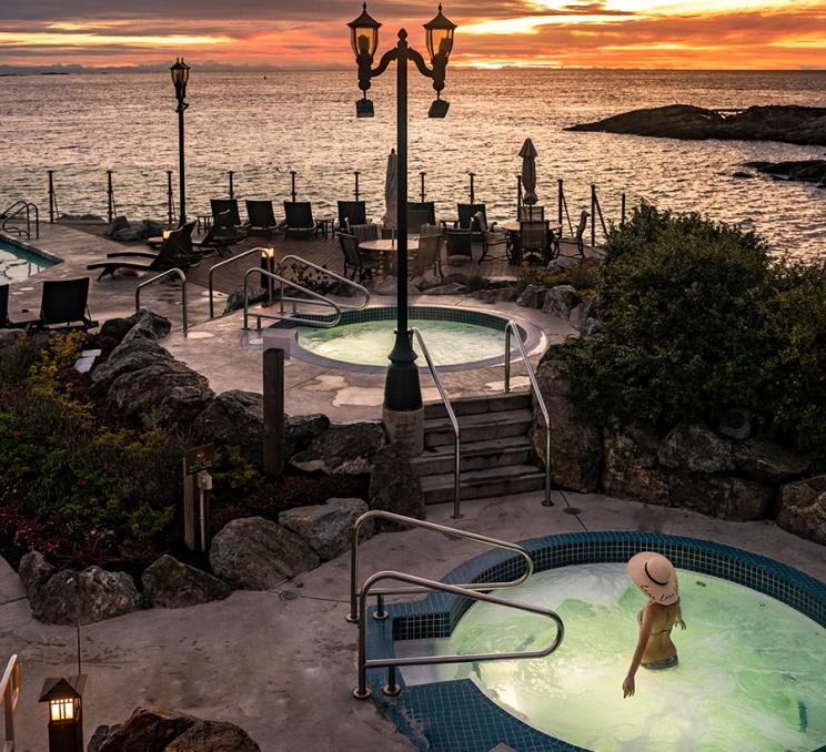 A woman soaks in the mineral pools at the Oak Bay Beach Hotel in Victoria, BC