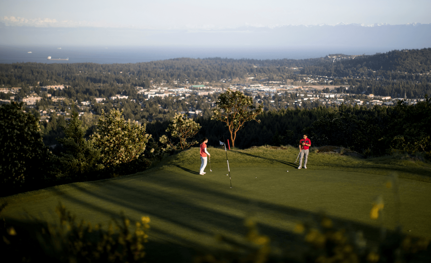 two people playing golf