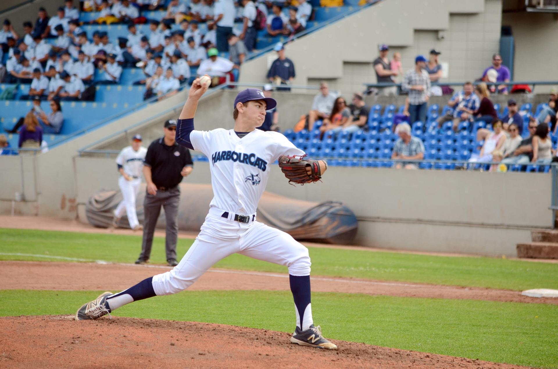A Harbour Cats player pitches the ball at a game in Victoria, BC