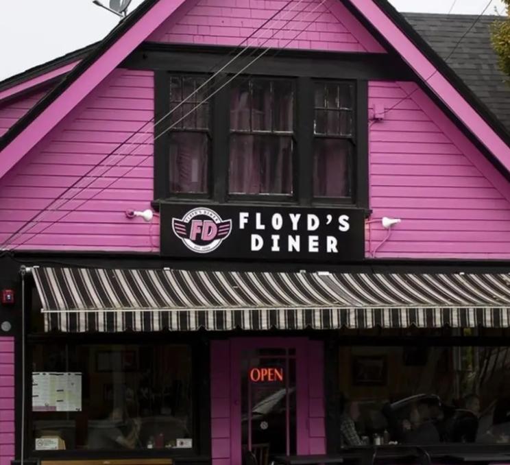 The bright pink facade of Floyd's Diner in Victoria, BC