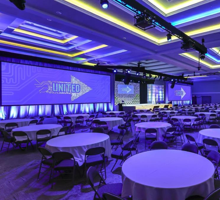 LED lighting illuminates a gala setting at a conference in the Victoria Conference Centre