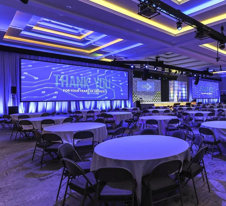 A screen set up for a conference at the Victoria Conference Centre in Victoria, BC