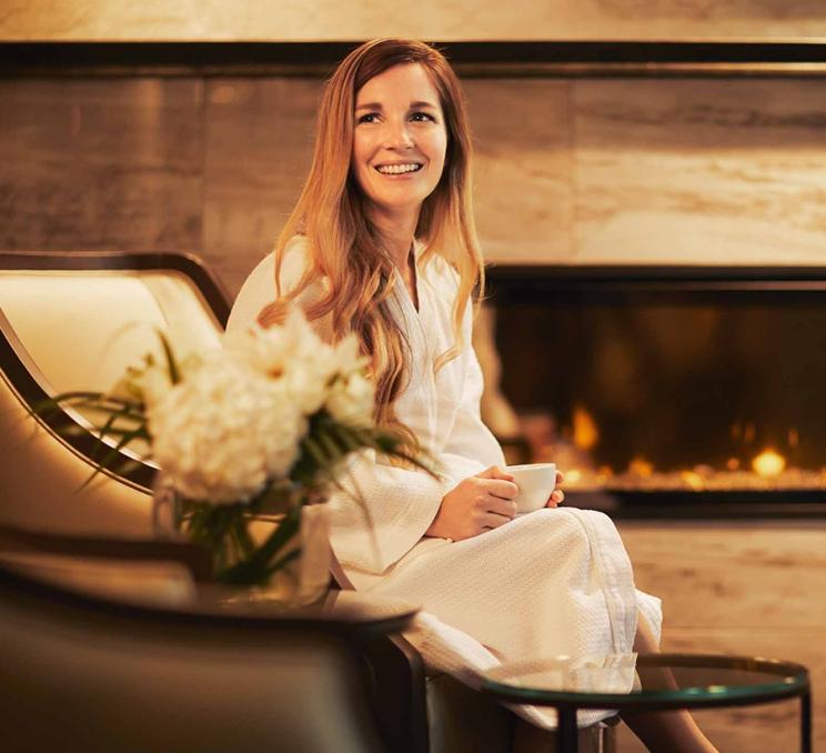 A woman enjoys a cup of tea at the Willow Stream Spa at the Fairmont Empress in Victoria, BC