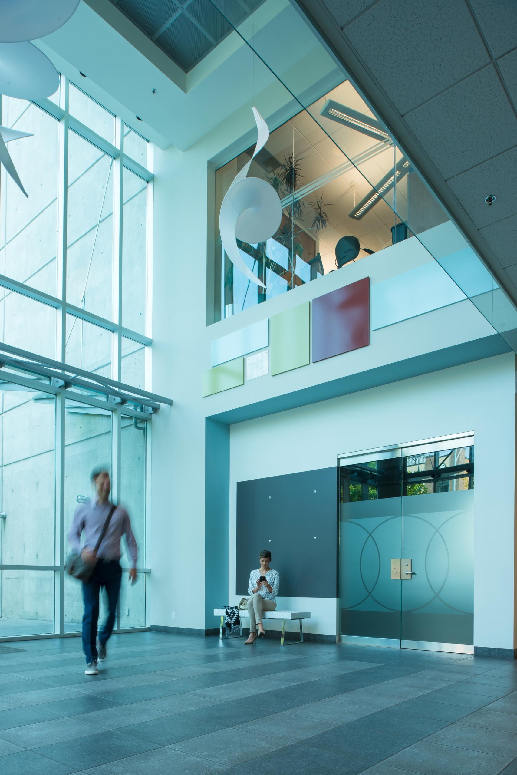 Man Walking through Interior of Building