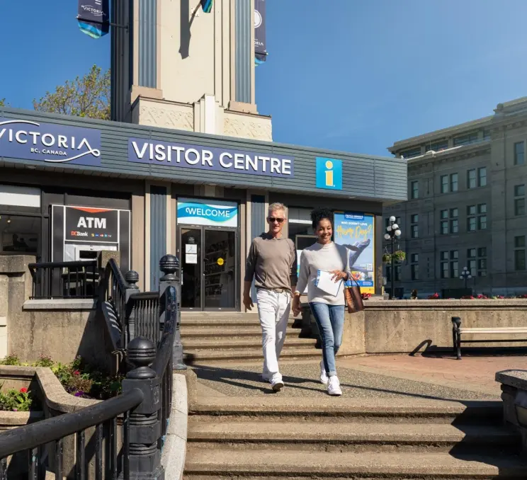 downtown A nested independent couple visits the Victoria Visitor Centre
