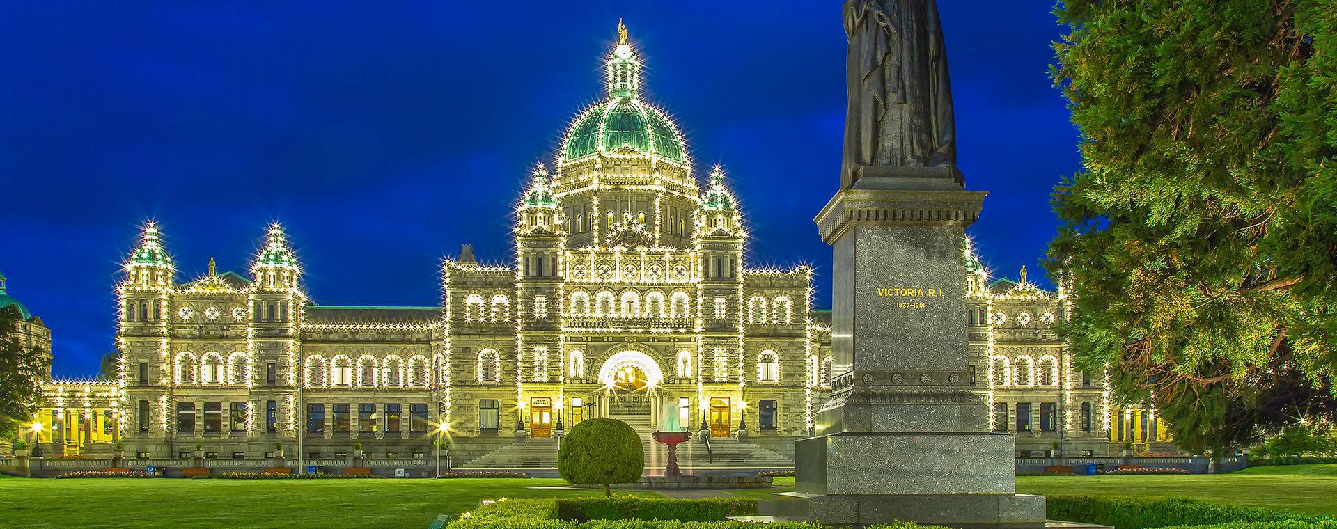 Parliament Building with lights and status in the night time