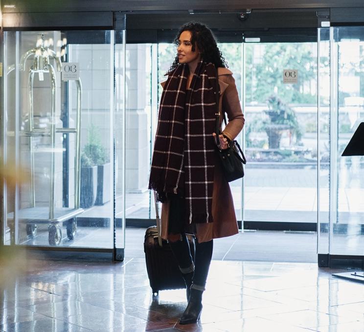 A woman arrives at Oak Bay Beach Hotel in Victoria, BC