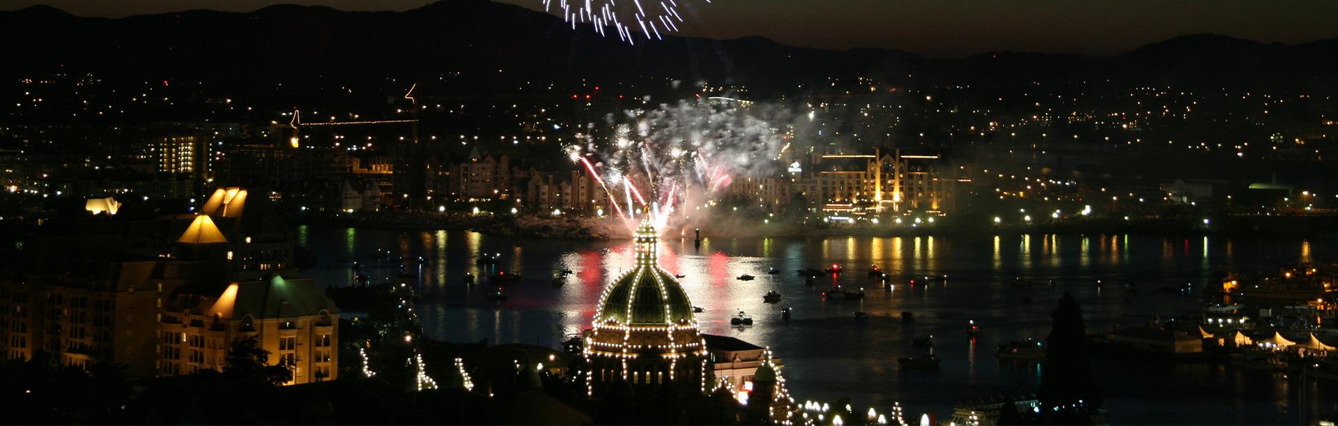 An aerial view of a fireworks show on Victoria's Inner Harbour