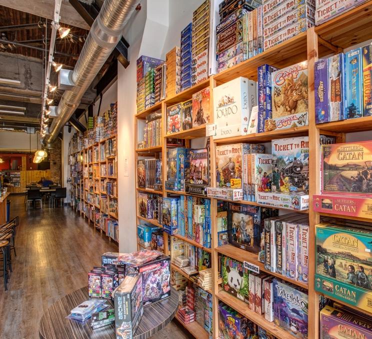 A wall of board games at Interactivity Board Game Cafe in Victoria, BC