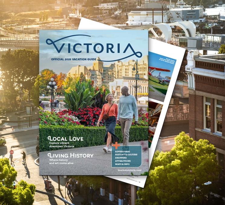 The cover the of 2025 Victoria Vacation guide spread of an image of downtown Victoria, BC at sunset