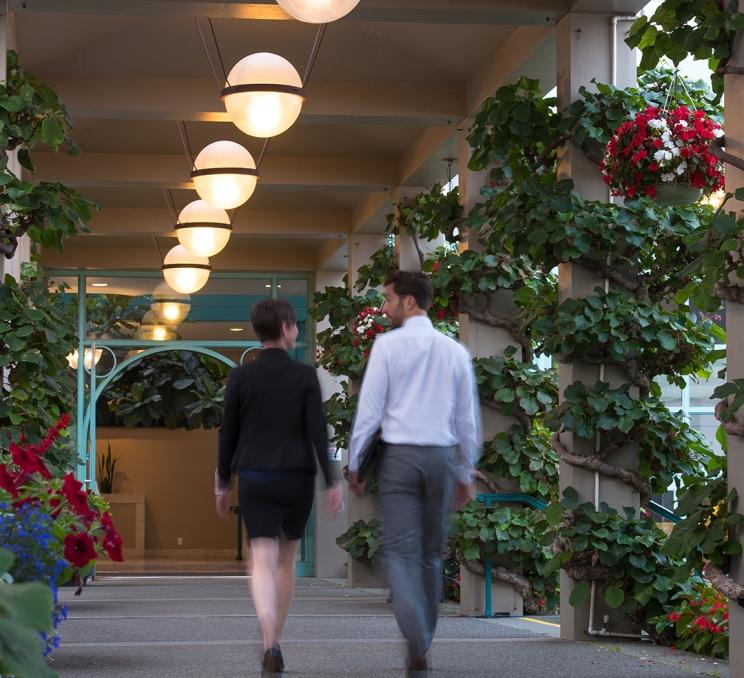 A Destination Greater Victoria employee walks with a client at the Victoria Conference Centre in Victoria, BC